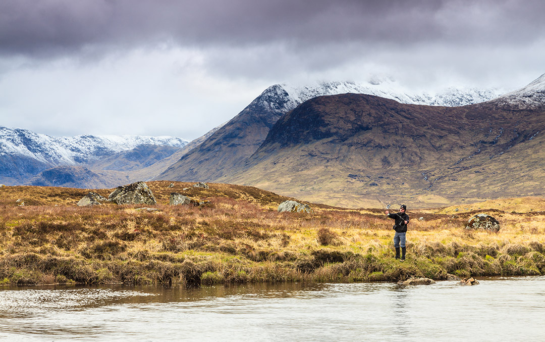 Fly fishing in a river in the Scottish Highlands